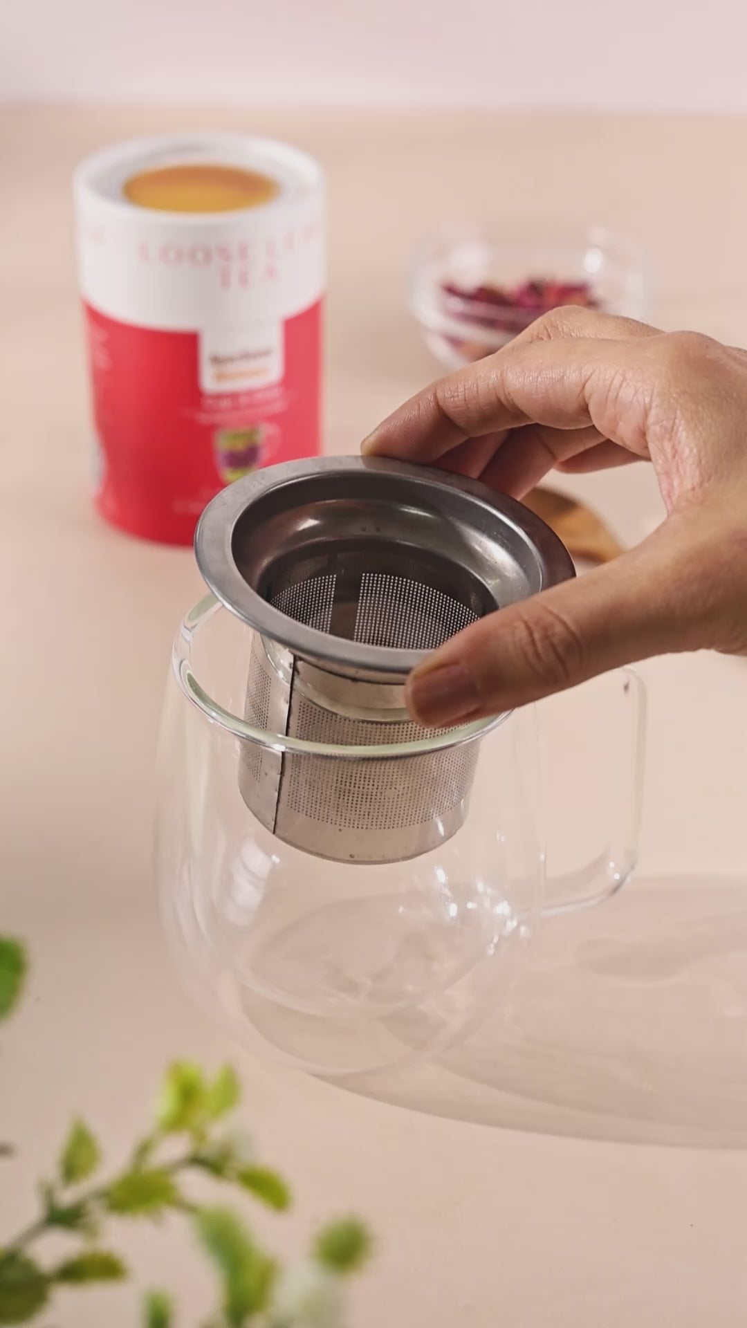 How to brew loose leaf tea using organic rose loose tea in a strainer and a cup